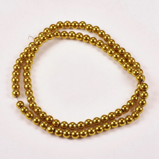 Αιματίτης στρογγυλός χρυσός 4mm