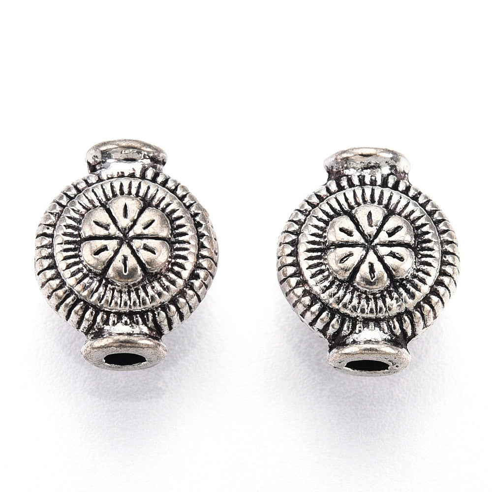 Μεταλλική χάντρα με λουλούδι 9mm